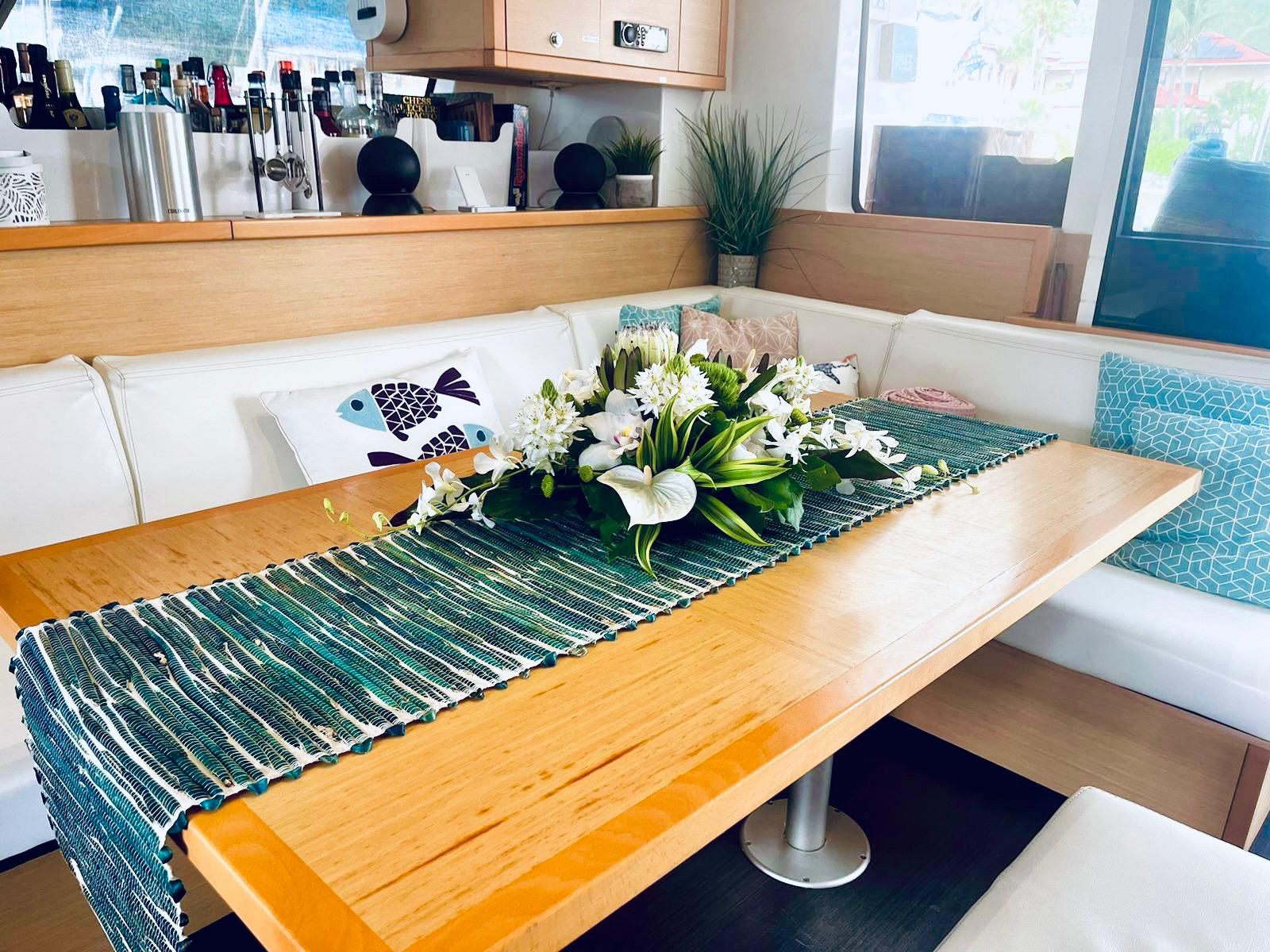 Saloon dining table with fresh orchids