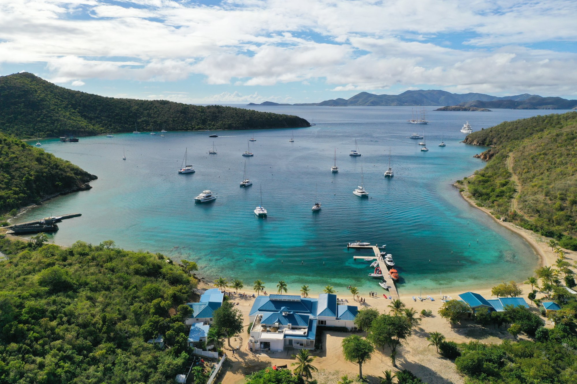 The Bight Norman Island BVI anchorage aerial view with yachts at mooring